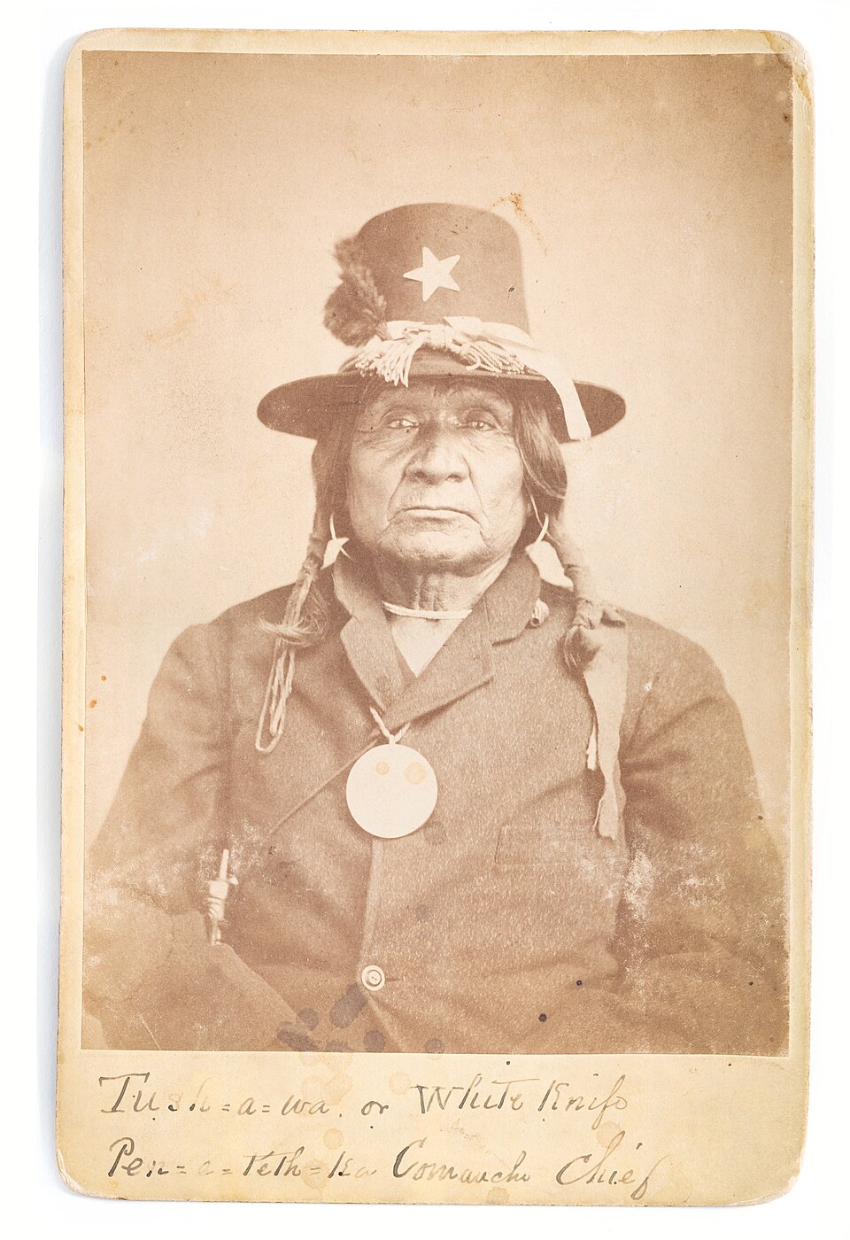 An aged cabinet-card portrait of Tosawa wearing a hat with a star; the complete mount retains a handwritten identification as White Knife and a Penateka Comanche chief.
