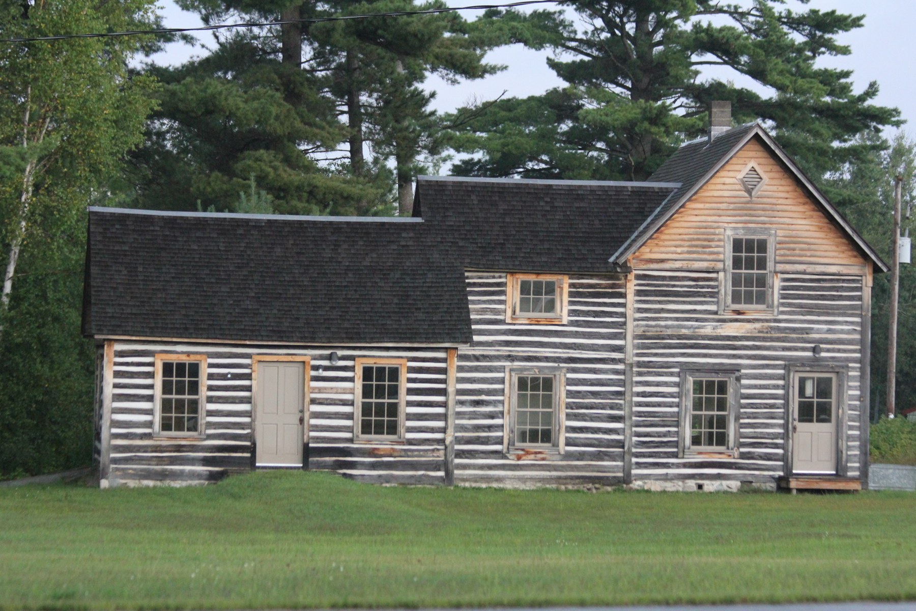 The restored Dinesen-Motzfeldt-Hettinger Log House at Mole Lake, photographed in September 2013.